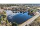 Aerial view of community with lake, mature trees, and single-Gathering homes at 2452 Bay Harbor Dr, Raleigh, NC 27604