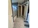 Bathroom featuring a shower with glass doors and decorative tile flooring at 2452 Bay Harbor Dr, Raleigh, NC 27604