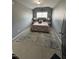Bedroom featuring vaulted ceilings, a large rug, and neutral-toned walls at 2452 Bay Harbor Dr, Raleigh, NC 27604