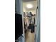 Walk-in closet filled with hanging clothes and other storage items at 2452 Bay Harbor Dr, Raleigh, NC 27604