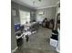 Inviting dining space with natural light, a stylish dining set, and a view into the kitchen area at 2452 Bay Harbor Dr, Raleigh, NC 27604