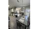 Open-concept dining and kitchen area featuring a large dining table and connection to the living space at 2452 Bay Harbor Dr, Raleigh, NC 27604