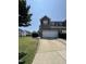 Townhouse with brick accents, a two-car garage and well-maintained landscaping at 2452 Bay Harbor Dr, Raleigh, NC 27604