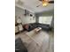 Cozy living room with a sectional sofa, stylish rug, and ample natural light from the windows at 2452 Bay Harbor Dr, Raleigh, NC 27604