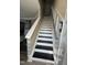 Modern staircase with black painted treads and white risers at 2452 Bay Harbor Dr, Raleigh, NC 27604