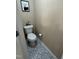 Toilet room featuring decorative tile flooring and neutral painted walls at 2452 Bay Harbor Dr, Raleigh, NC 27604