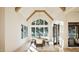 Sun-filled dining room with large windows, high ceiling, and seating for eight at 249 Mollie Meadow Dr, Zebulon, NC 27597
