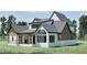 Exterior of home with black trim and white and brown siding at 249 Mollie Meadow Dr, Zebulon, NC 27597