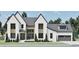 Charming home with white brick, dark framed windows, gray roof, and lovely lawn at 249 Mollie Meadow Dr, Zebulon, NC 27597