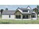 Exterior of home with covered porch and a well maintained lawn at 249 Mollie Meadow Dr, Zebulon, NC 27597