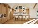 Beautiful bright kitchen with seating at island, modern lighting, and decorative backsplash at 249 Mollie Meadow Dr, Zebulon, NC 27597
