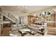 Bright and open living area with fireplace, adjacent to a modern kitchen with island seating at 249 Mollie Meadow Dr, Zebulon, NC 27597