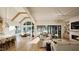 Bright, open living room with fireplace, large sliding glass doors, and an adjacent dining area at 249 Mollie Meadow Dr, Zebulon, NC 27597