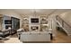 Inviting living room with a fireplace, built-ins, and hardwood floors, perfect for cozy evenings at 249 Mollie Meadow Dr, Zebulon, NC 27597