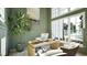 Stylish home office with olive green paneled walls, built-in shelving, and a large window at 249 Mollie Meadow Dr, Zebulon, NC 27597