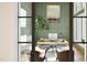 Contemporary office space features a wooden desk, comfortable chairs, and stylish decor at 249 Mollie Meadow Dr, Zebulon, NC 27597