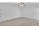 This bedroom features neutral carpet, white walls, and a ceiling fan at 267 Ashley Woods Ct, Clayton, NC 27527