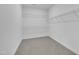 Walk in closet with wire shelving and carpeted floors at 267 Ashley Woods Ct, Clayton, NC 27527