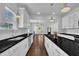 Open floor plan with stainless steel appliances, granite countertops and view to the living area at 267 Ashley Woods Ct, Clayton, NC 27527