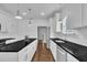 Well-lit kitchen featuring granite countertops, stainless steel appliances, and white cabinetry at 267 Ashley Woods Ct, Clayton, NC 27527