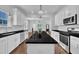 Well-lit kitchen with granite countertops, stainless steel appliances and white cabinetry at 267 Ashley Woods Ct, Clayton, NC 27527