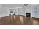 Bright, open living space featuring hardwood floors, modern lighting, and a cozy fireplace at 267 Ashley Woods Ct, Clayton, NC 27527
