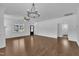 Spacious living room boasting wood floors, stylish lighting, and natural light from large windows at 267 Ashley Woods Ct, Clayton, NC 27527
