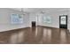 Inviting living space with wood floors, a fireplace, and plenty of natural light, chandelier, and ceiling fan at 267 Ashley Woods Ct, Clayton, NC 27527