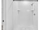 Modern shower stall with white subway tile surround and recessed shelving at 267 Ashley Woods Ct, Clayton, NC 27527