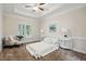 Serene bedroom with neutral palette, tray ceiling, plush carpet, and plenty of natural light at 3020 Woods Walk Way, Rocky Mount, NC 27804