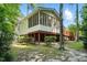 Back of the home featuring a screened porch, deck, backyard, and mature trees at 3020 Woods Walk Way, Rocky Mount, NC 27804