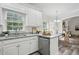 Kitchen featuring white cabinets, stainless steel appliances, granite countertops, and wood-look floors at 3020 Woods Walk Way, Rocky Mount, NC 27804