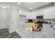 Spacious kitchen with white cabinets, granite countertops, a kitchen island, and stainless steel appliances at 3020 Woods Walk Way, Rocky Mount, NC 27804