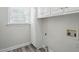 Functional laundry room featuring built-in cabinets, ample storage, and efficient layout at 3020 Woods Walk Way, Rocky Mount, NC 27804