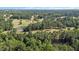 Aerial view of the home and surrounding golf course at 3070 Cameron Dr, Henderson, NC 27536