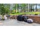 Backyard featuring a large patio with a brick wall, ideal for outdoor entertaining at 3070 Cameron Dr, Henderson, NC 27536