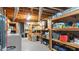 Functional basement laundry and storage area with shelving and appliances at 3070 Cameron Dr, Henderson, NC 27536
