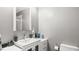 Bathroom featuring a white vanity with sleek fixtures and a mirrored medicine cabinet at 3070 Cameron Dr, Henderson, NC 27536