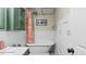 Charming bathroom with a clawfoot tub, green cabinets, and vintage-inspired decor at 3070 Cameron Dr, Henderson, NC 27536