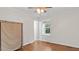 Sunlit bedroom with hardwood floors, neutral paint, and a window with view of the outside at 3070 Cameron Dr, Henderson, NC 27536