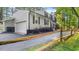 Traditional home featuring an attached garage with black shutters and mature landscaping at 3070 Cameron Dr, Henderson, NC 27536