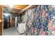 Basement laundry area featuring a floral curtain, with washer and dryer hookups at 3070 Cameron Dr, Henderson, NC 27536