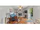 Inviting living room featuring hardwood floors, a fireplace, built-in shelving, and access to the outdoors at 3070 Cameron Dr, Henderson, NC 27536