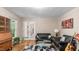 Comfortable living room with hardwood flooring, modern sofas, natural light, and access to the exterior at 3070 Cameron Dr, Henderson, NC 27536
