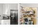 Bright white pantry featuring adjustable wire shelving, and ample storage for canned and dry goods at 3070 Cameron Dr, Henderson, NC 27536