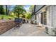 Outdoor patio with ample seating areas and lush backyard views at 3070 Cameron Dr, Henderson, NC 27536