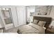 Comfortable bedroom with a view to the bathroom, featuring natural light and a neutral color palette at 338 Cottage Hill Way, Knightdale, NC 27604