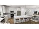 Bright kitchen with island and stainless steel appliances, open to the dining area for easy entertaining at 338 Cottage Hill Way, Knightdale, NC 27604