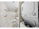 Bathroom featuring shower-tub, toilet, modern vanity, and stackable washer and dryer at 3427 Mill Run, Raleigh, NC 27612
