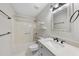 Bathroom featuring a tub-shower combo, toilet, and vanity with a decorative mirror at 3427 Mill Run, Raleigh, NC 27612